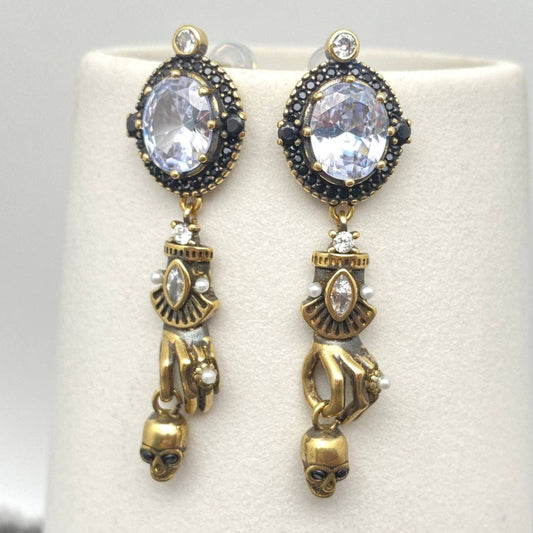 Skull In Hand Earrings