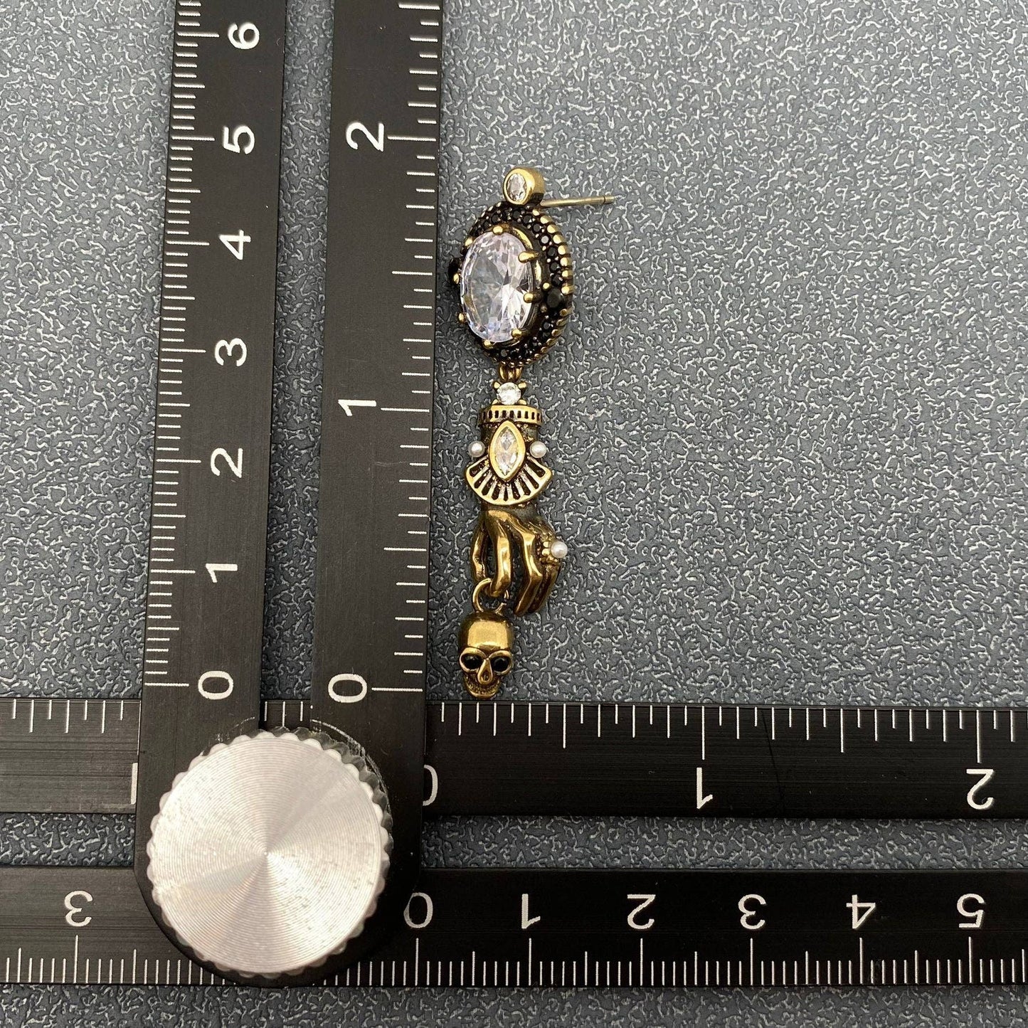 Skull In Hand Earrings