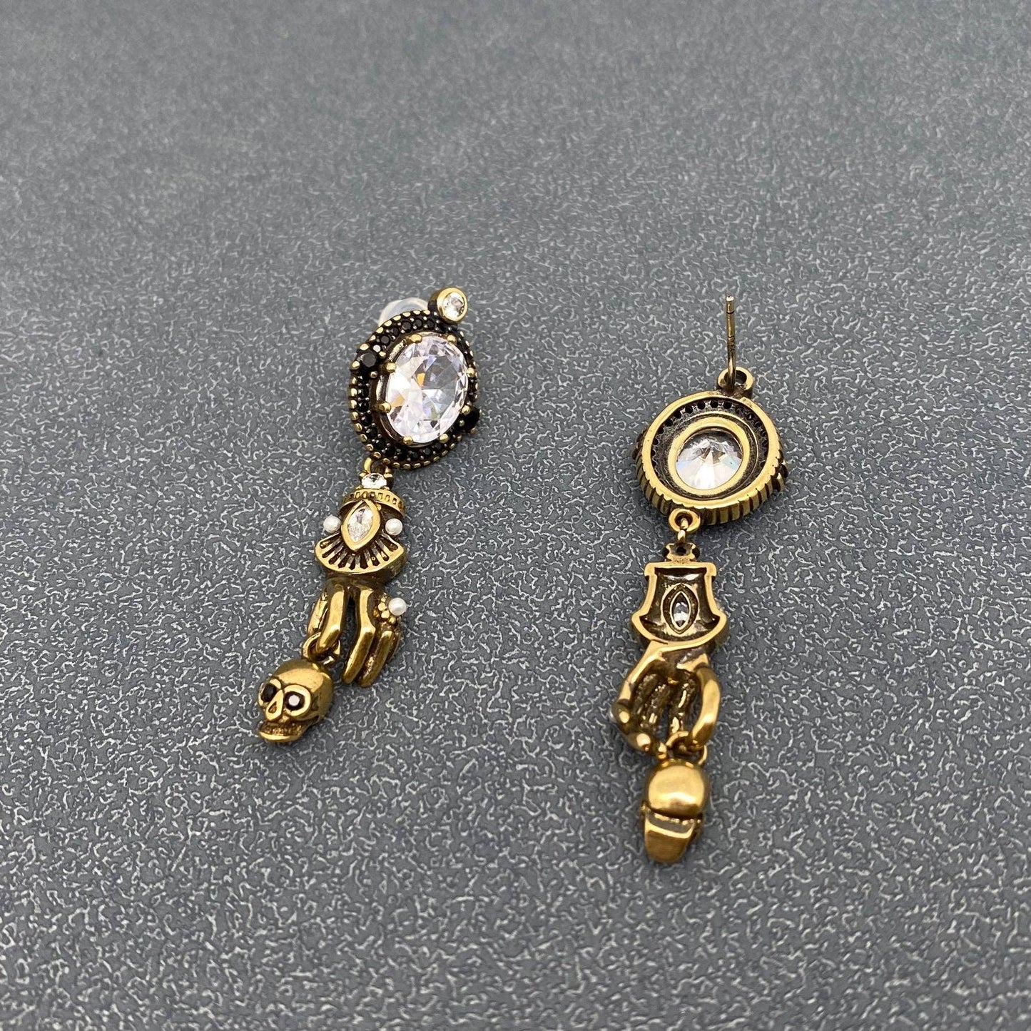 Skull In Hand Earrings